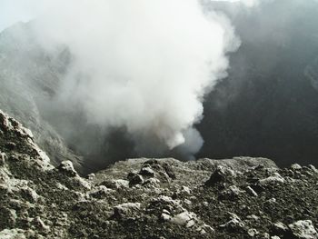 Smoke emitting from volcanic mountain