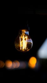 Close-up of illuminated light bulb