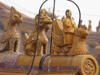 Close-up of roof detail of a pavilion in the forbidden city, beijing.