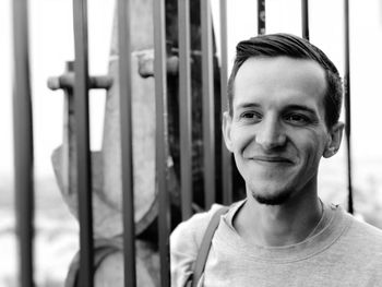 Close-up of smiling young man looking away
