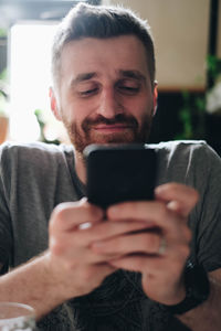 Portrait of man using mobile phone