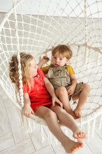 Children swinging on a swing