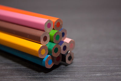 Close-up of multi colored pencils on table