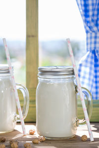 Close-up of glass jar on table