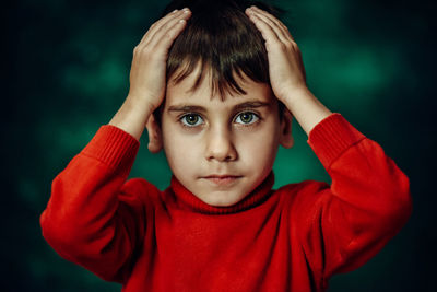 Portrait of boy against blurred background