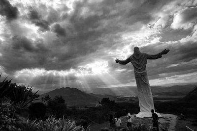 Scenic view of landscape against cloudy sky
