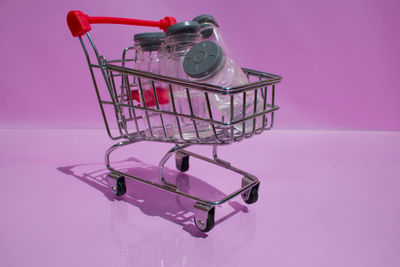 Close-up of metallic object against pink background