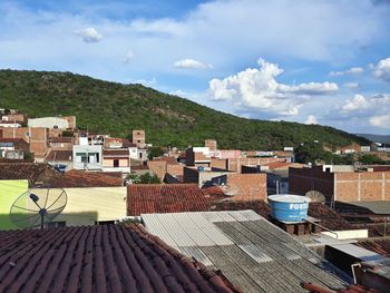 Buildings in town against sky