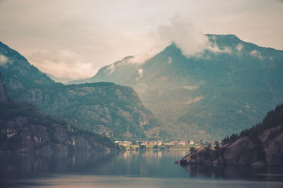 Scenic view of lake and mountains against sky