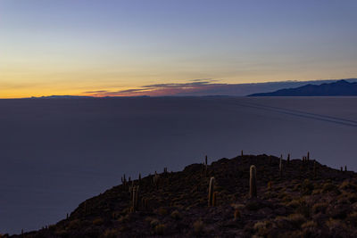 Scenic view of mountains against sky during sunset