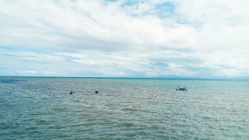 Scenic view of sea against blue sky