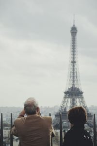 Senior couple looking at eiffel tower