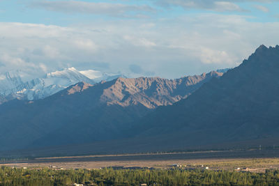 Scenic view of snowcapped mountains against sky