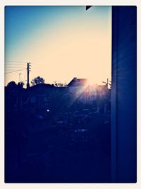 Silhouette of house at sunset