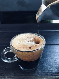 Close-up of coffee cup on table