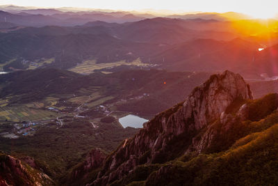 Scenic view of mountains against sky during sunset