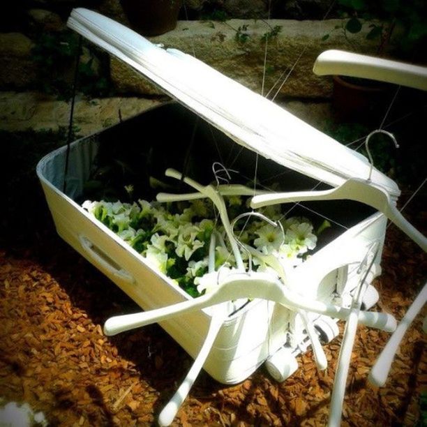 transportation, plant, high angle view, close-up, mode of transport, white color, no people, field, day, still life, nature, outdoors, nautical vessel, abandoned, boat, sunlight, focus on foreground, dirt, damaged, growth