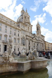 Sunny view of piazza navona with the moor fountain or fontana del moro and tourists