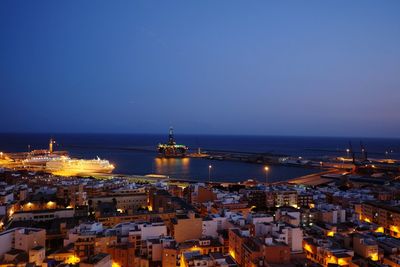 High angle view of illuminated city at night