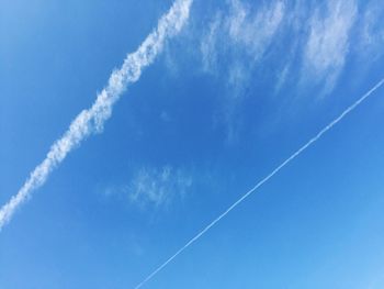 Low angle view of vapor trail against sky