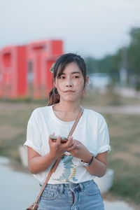 Portrait of girl standing outdoors