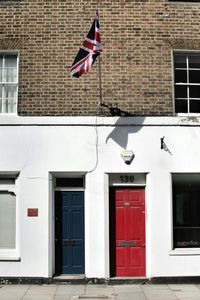 Low angle view of flag against building