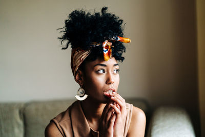 Portrait of young woman looking away