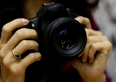 Close-up of hand holding camera