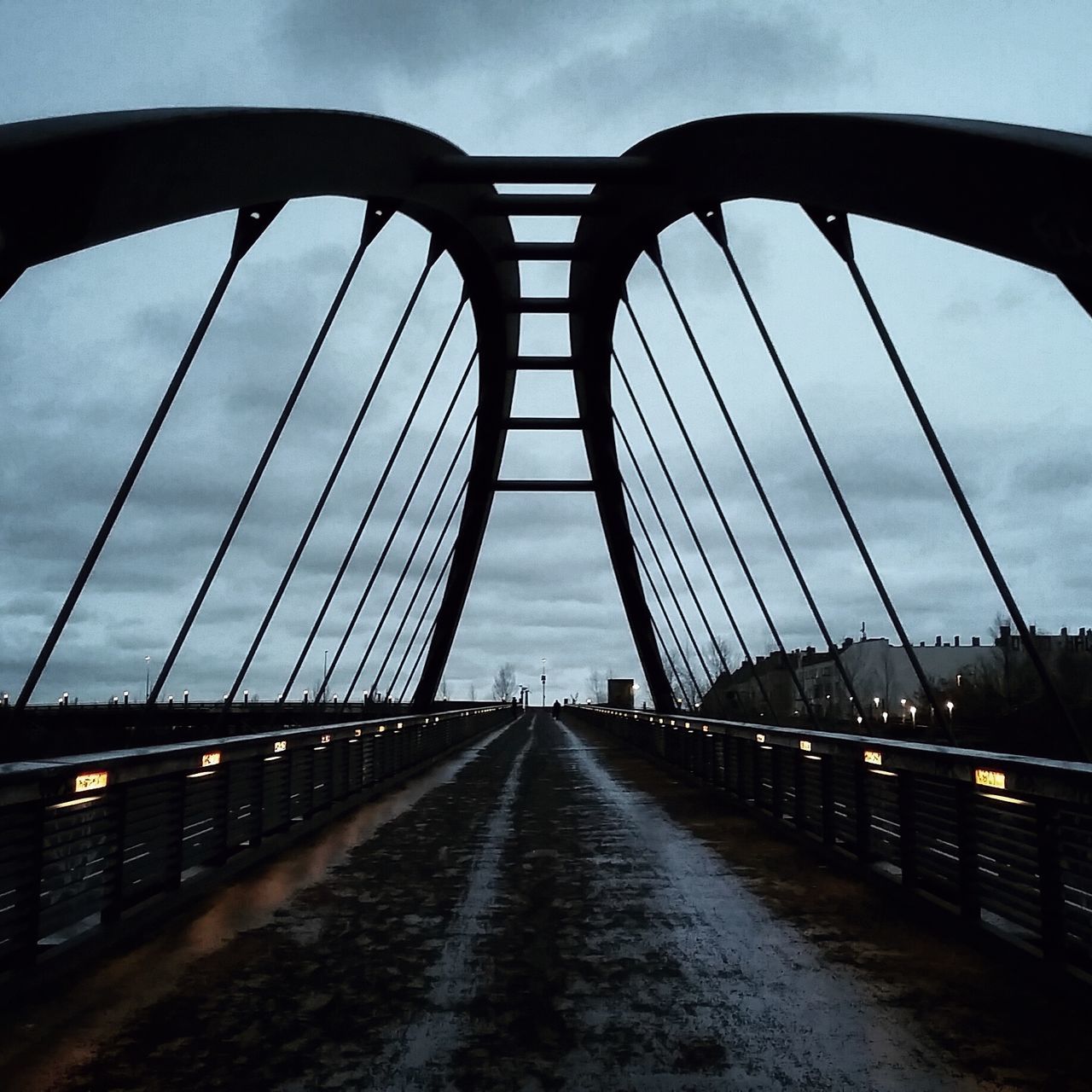 connection, bridge - man made structure, architecture, built structure, transportation, engineering, sky, bridge, suspension bridge, the way forward, arch, low angle view, diminishing perspective, road, long, cloud - sky, river, famous place, car, travel destinations