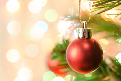 Close-up of christmas decorations hanging on tree