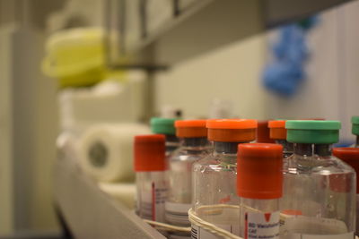 Close-up of bottles on table in laboratory