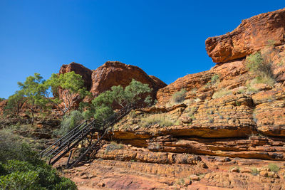 Scenic view of rocky mountains against clear blue sky