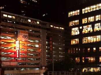 Illuminated buildings in city at night