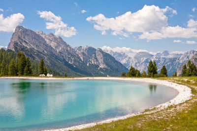 Scenic view of lake and mountains against sky