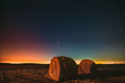 Scenic view of landscape against sky at night