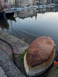 Boats moored at harbor