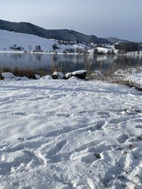 Scenic view of snow covered mountains against sky