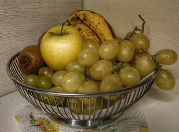 Close-up of fruits in basket on table