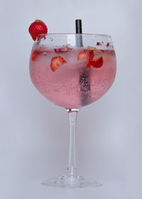 Close-up of wine glass against white background