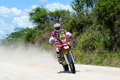 Man riding motorcycle on road