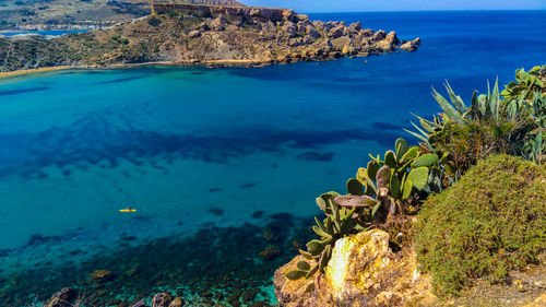 Scenic view of sea against blue sky