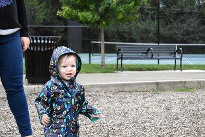 Boy playing on slide at playground