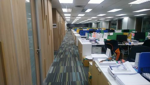 People working on table in illuminated room