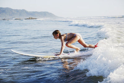 Girl surfboarding