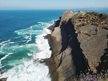 High angle view of rock formations and sea