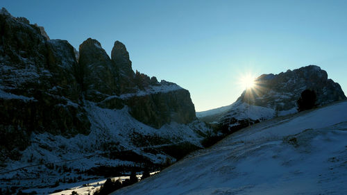 Scenic view of snow mountains against sky