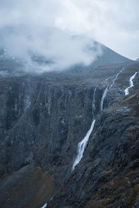Waterfall and rocky cliff plateau in norway.