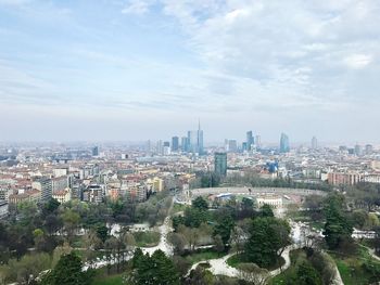 Aerial view of cityscape against sky