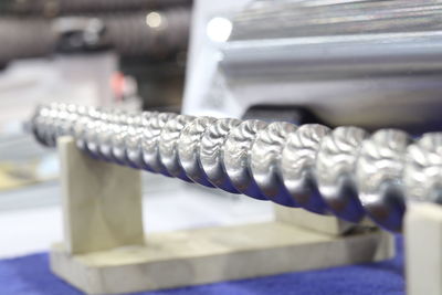 Close-up of spiral metal on table