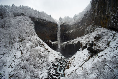 Waterfall in forest during winter